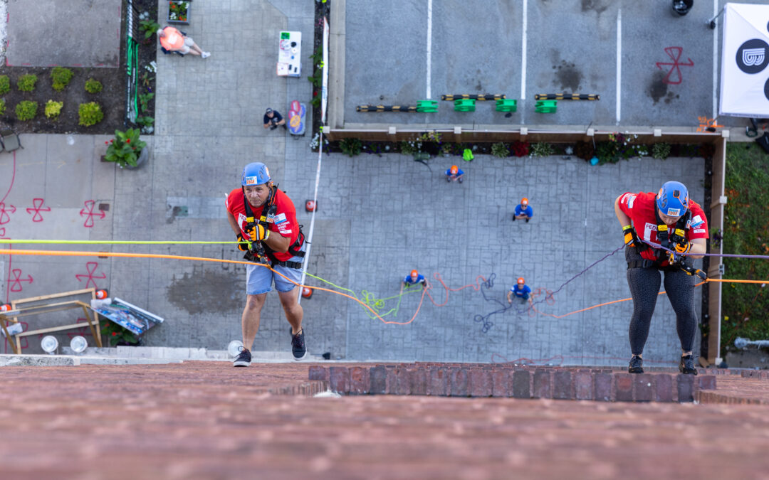 R.I.A. rappel over the edge of a building
