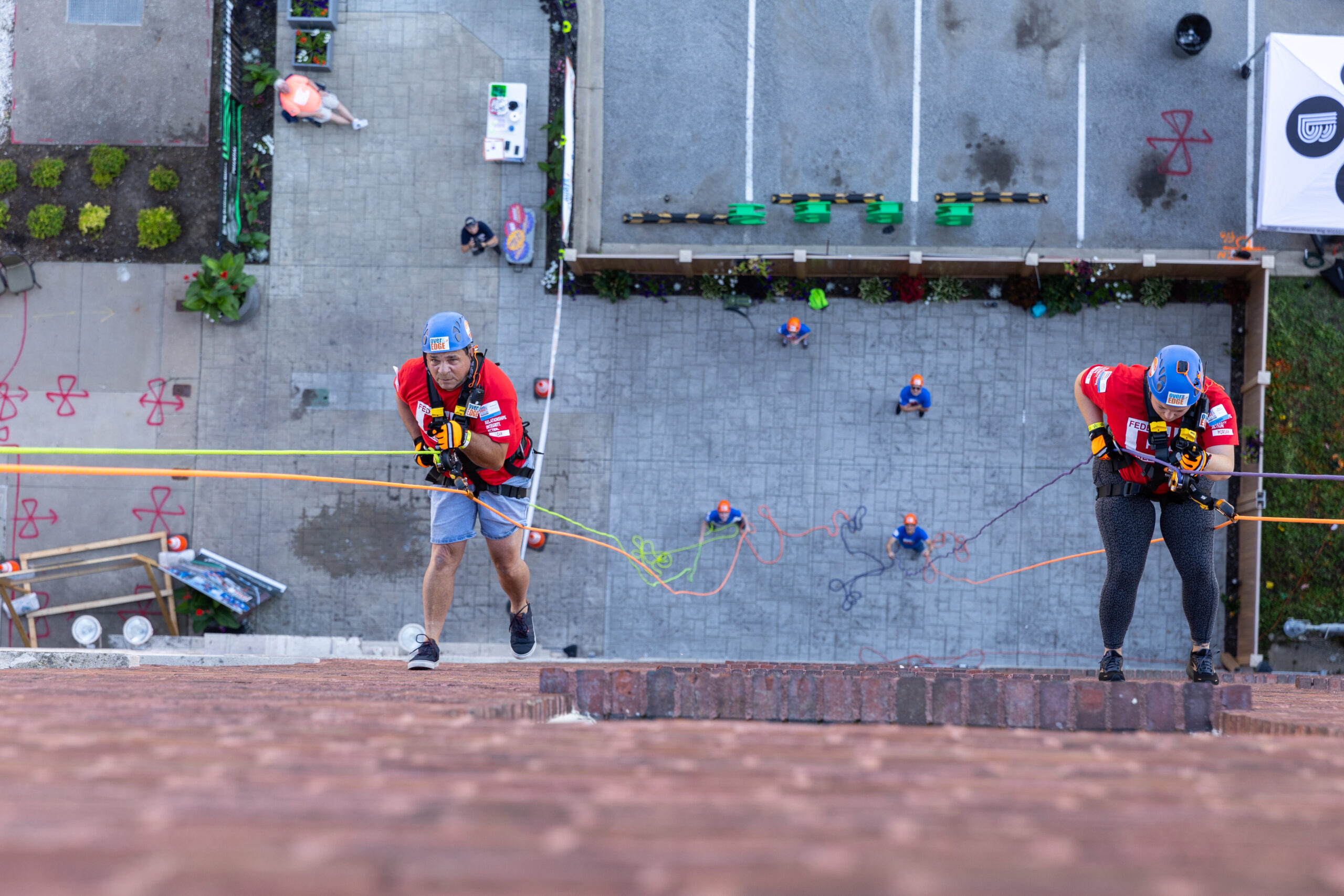 R.I.A. rappel over the edge of a building