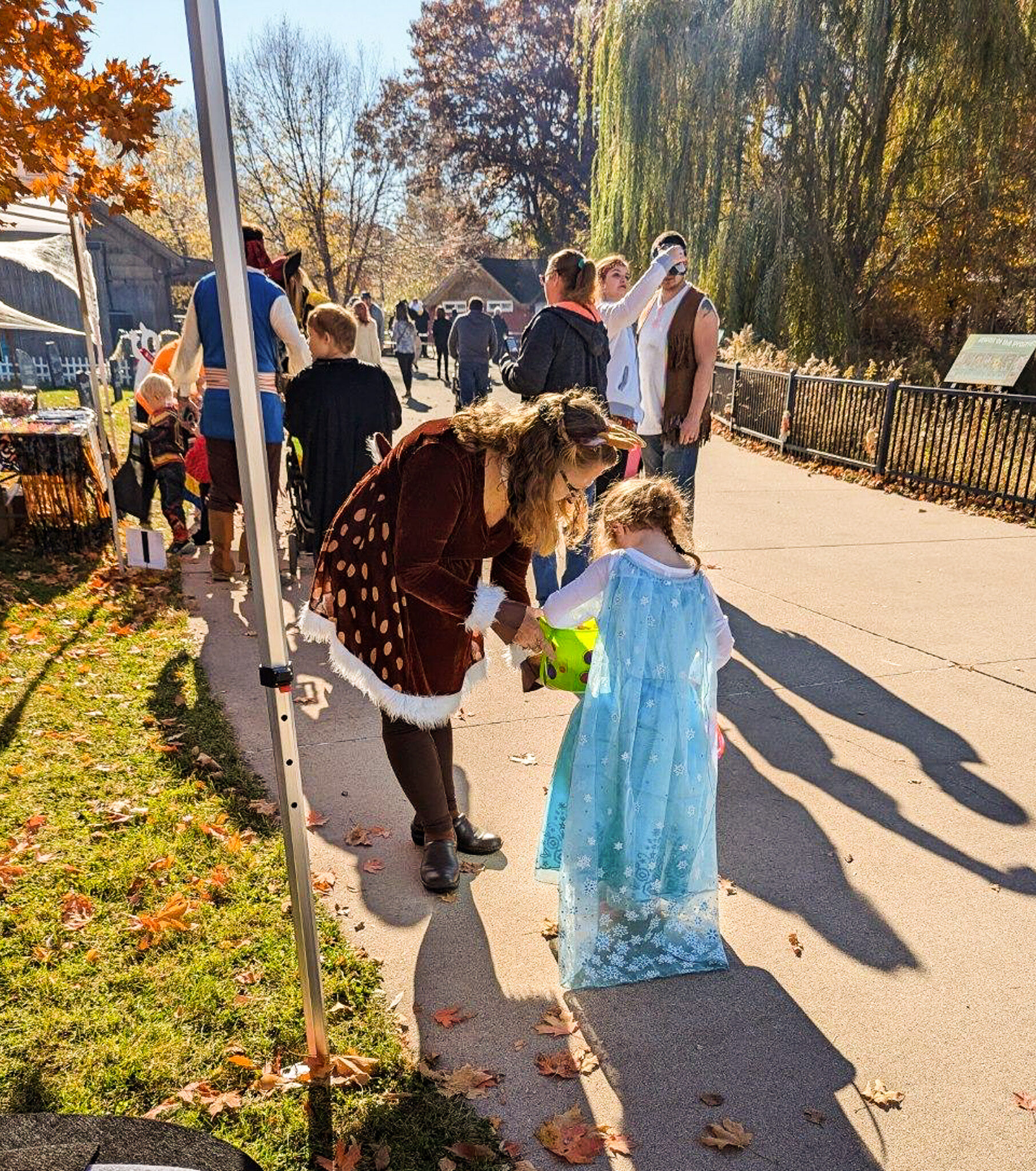 Staff handing out candty at Boo at the Zoo