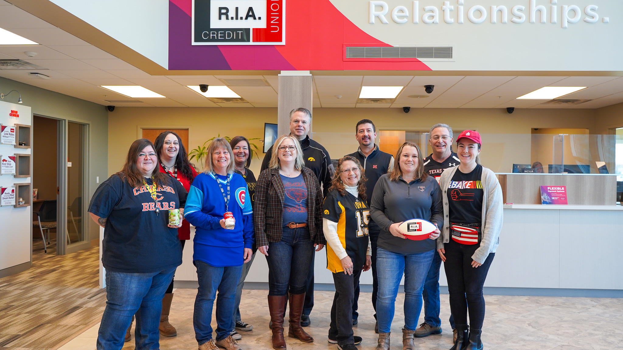 R.I.A. employees dressed in sports apparel for the food drive fundraiser