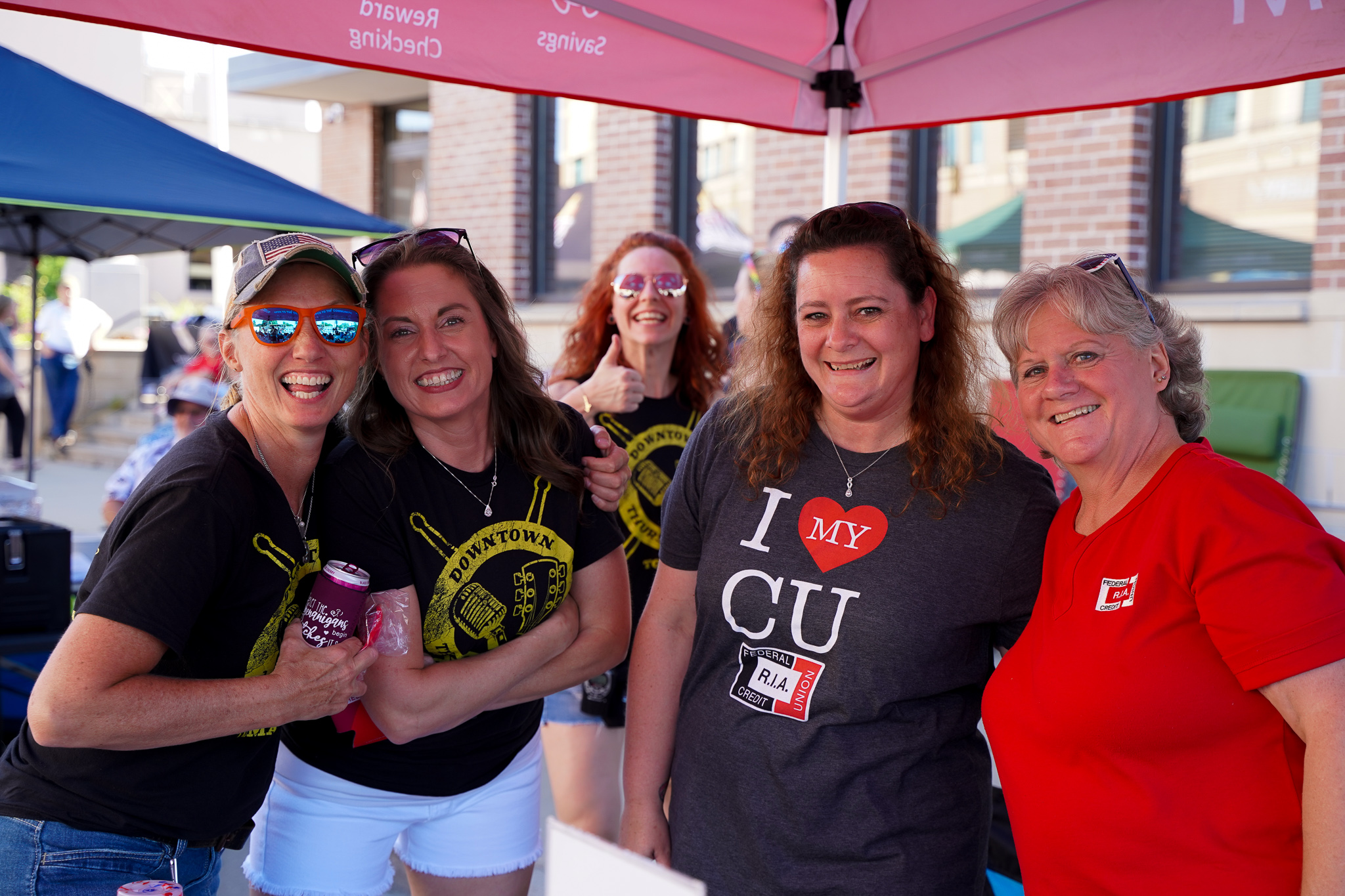 Wisconsin employees at a booth